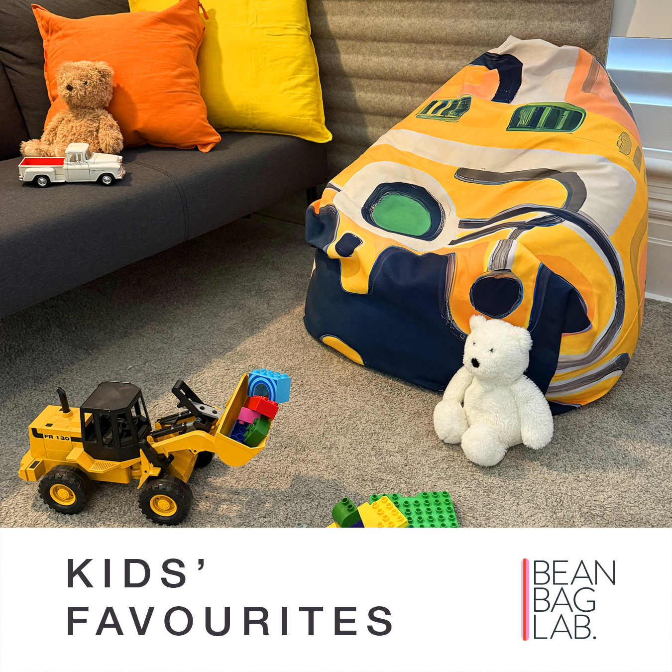 Kids’ Favourites bean bag scene — bright yellow Detour design styled in a playroom with toys, sofa cushions, and teddy bear.